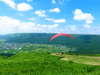 空のアクテビティ：阿蘇ではパラグライダーなどの体験も。阿蘇の雄大な景色を空から望むことができます。